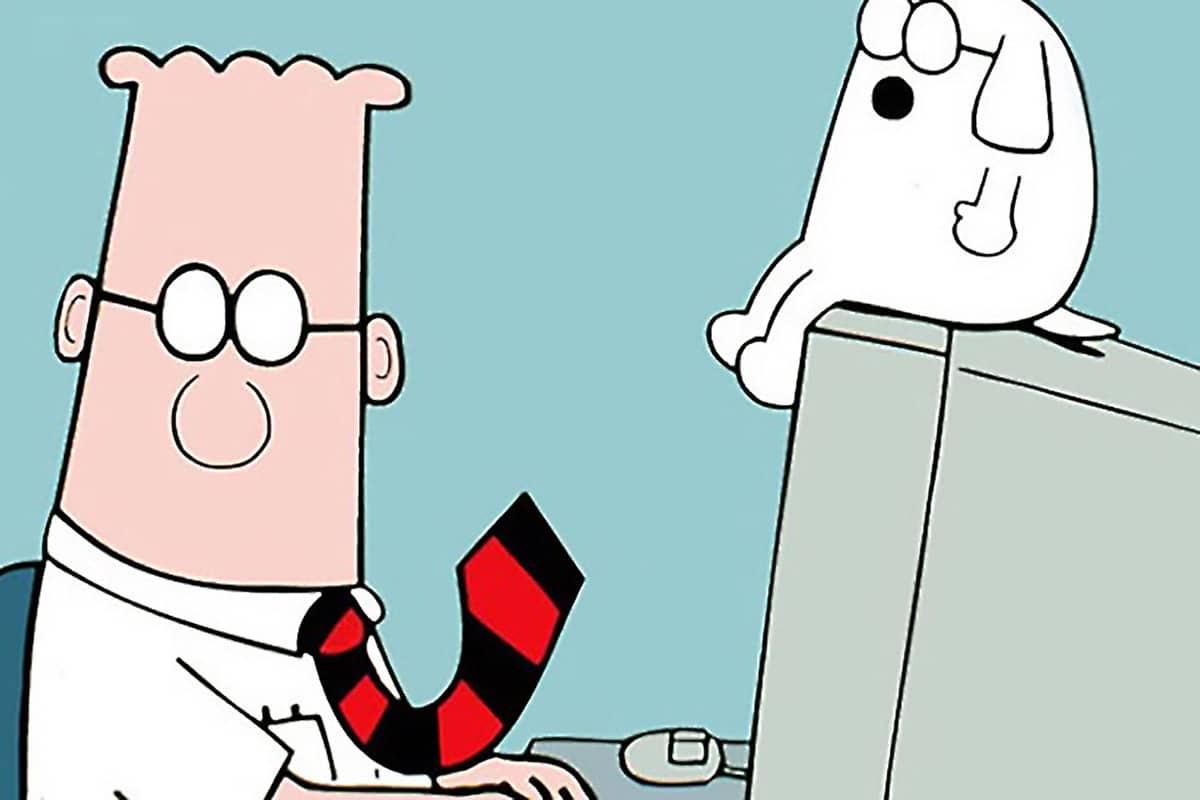 cartoon Dilbert travaillant avec un chien sur son ordinateur